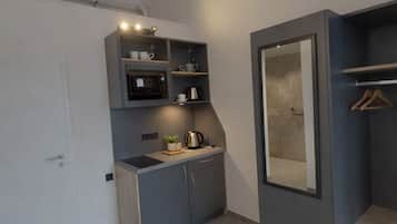 Deluxe Double Room, Kitchenette | Desk, laptop workspace, blackout drapes, soundproofing