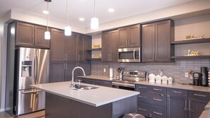Private kitchen - SLEEK DESIGN,PRIME LOCATION,EFFORTLESS STAY. (Edmonton)