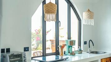 Deluxe Villa, Patio, Courtyard View | Private kitchen | Mini-fridge, microwave, oven, stovetop