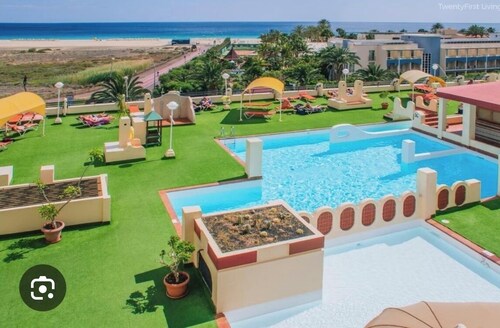 Palm Garden Apartment with terrace , amazing ocean view and swimming pool.