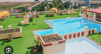 Palm Garden Apartment with terrace , amazing ocean view and swimming pool.