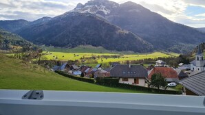 A view of a mountain range with a village in the foreground. - GITE DES FONTANETTES (LA COMPOTE)