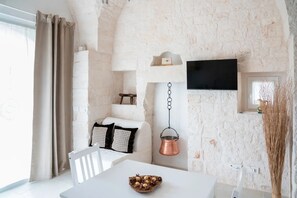 Appartement Deluxe, vue jardin | Coin séjour