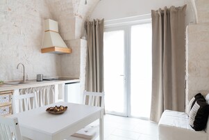 Appartamento Deluxe, vista giardino | Interni