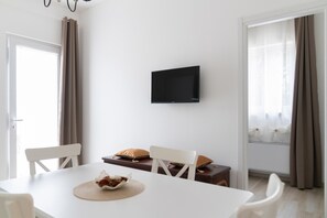 Apartamento, vista para o jardim | Opções para refeição