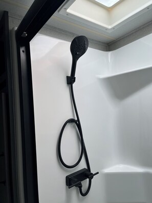 Shower, towels, soap, toilet paper