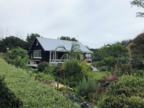 Secluded peaceful romantic cottage , set in beautiful gardens next to beach.