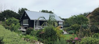 Secluded peaceful romantic cottage , set in beautiful gardens next to beach.