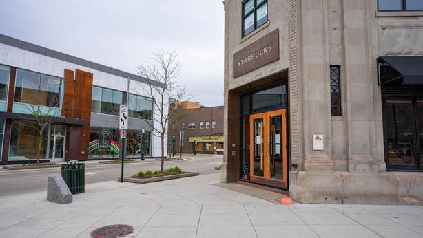 A Starbucks with a stone facade and large windows. - Serene Birmingham Retreat (Birmingham)