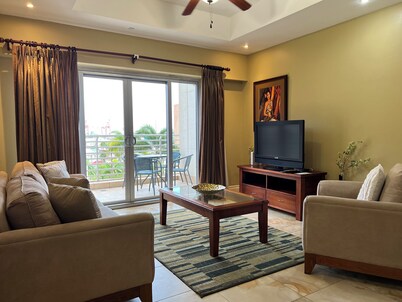 Graceful 1-bedroom condo with Wifi • One Woodbrook Place, P.O.S • Cozy • Safe •