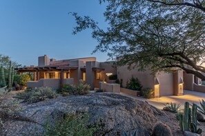 A desert-style building with a flat roof, large windows, and a patio area. - Near Boulder Resort & Spa, Greens Space & Views, Covered Patio w/Grill (Scottsdale)