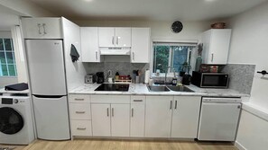 Microwave, stovetop, dishwasher - Cozy 2BR Garden Suite w/ Private Yard & EV Charger near Grouse Mountain & Trails (North Vancouver)