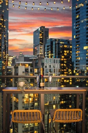 Outdoor dining - Skyline 2BR Sunset Retreat • Balcony Bar & Views (Southbank)