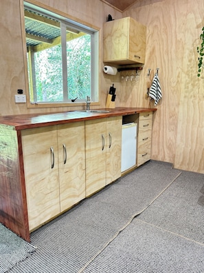 Interior - Secluded Redwood Cabin.  Built from a redwood tree that blew down in a cyclone (Ashley Clinton)