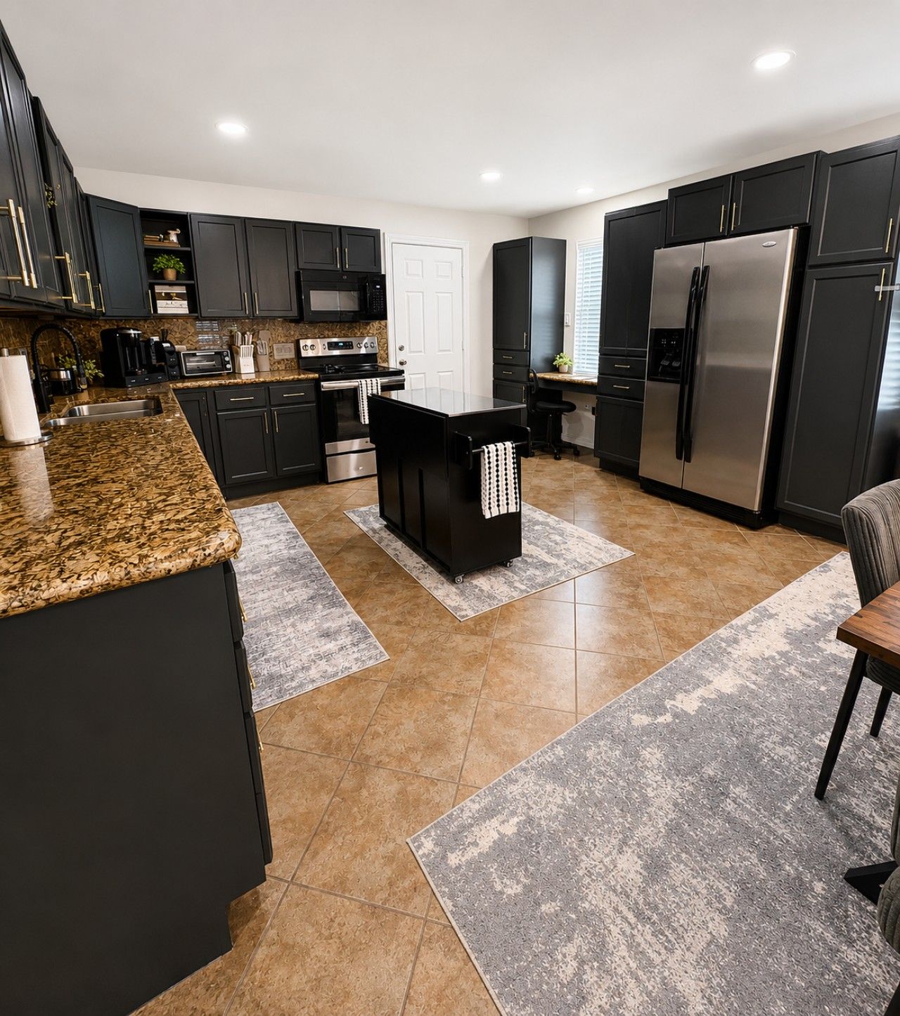 Keep your stay deliciously easy with a kitchen that brings together a refrigerator, range, microwave, and generous island for meal preparation.