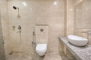 Shower, rainfall showerhead, slippers, towels