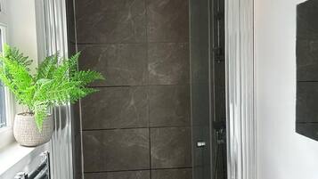 Shower, hair dryer, towels, soap