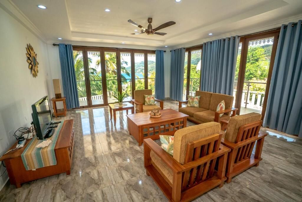 Family Apartment, Sea View | Living area | TV