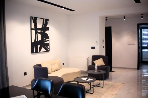 Deluxe Apartment, Balcony, City View | Living area | TV - Seven Floors (Tunis)