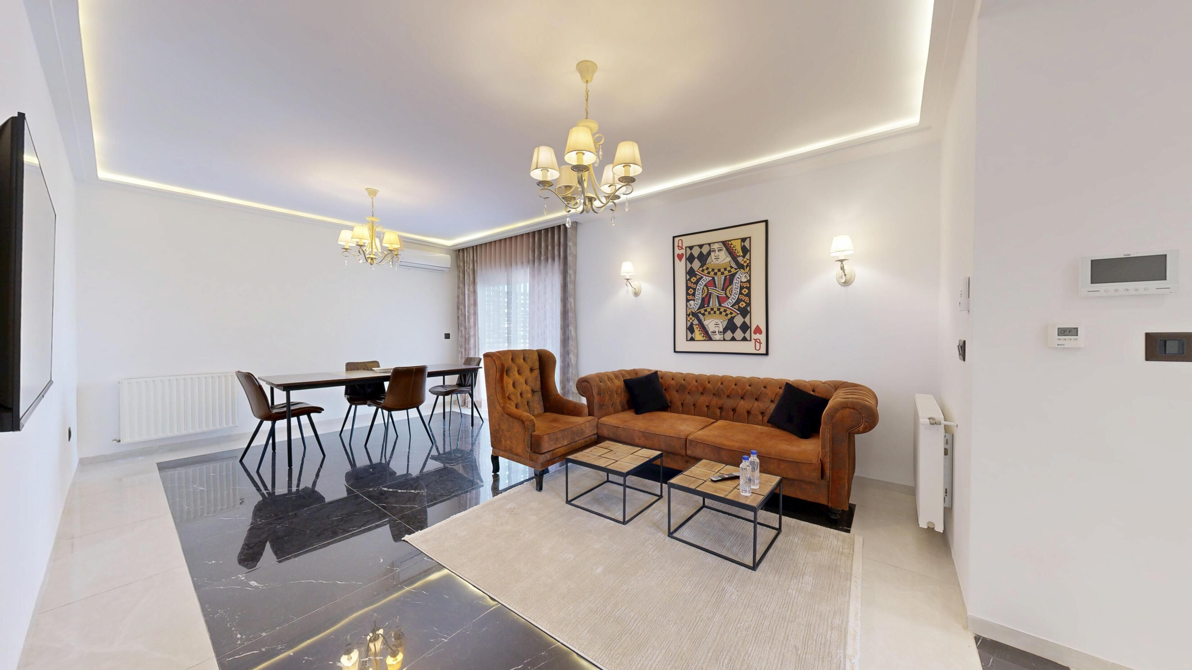 Appartement Deluxe | Coin séjour | Télévision