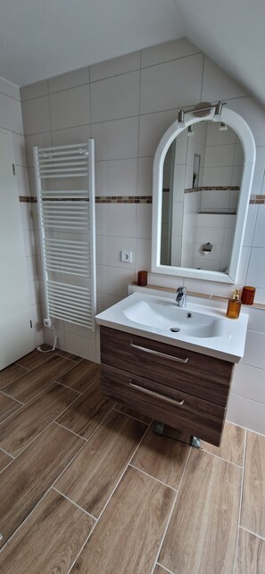 Shower, hair dryer, towels, toilet paper