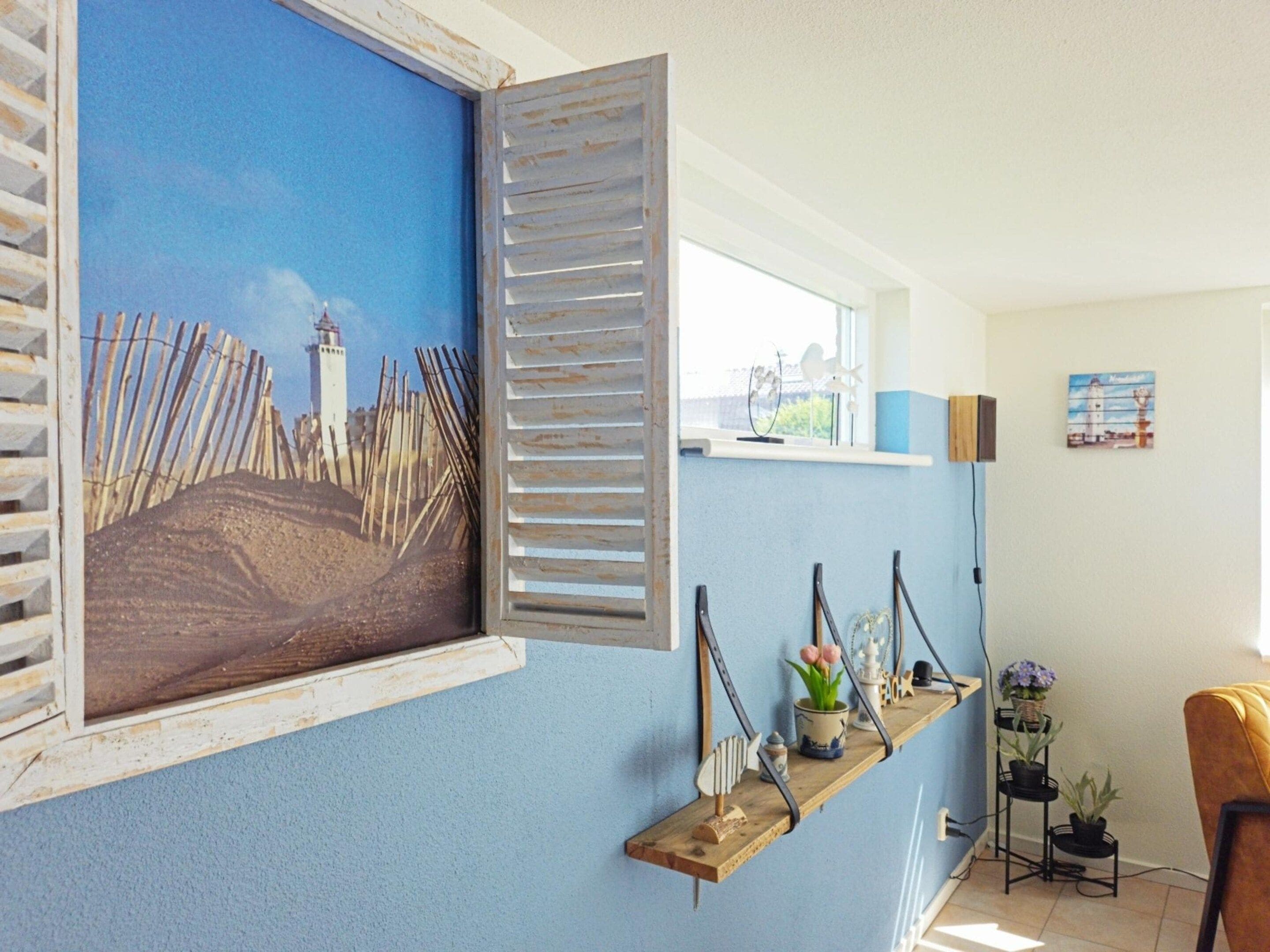 A room with a blue wall, a window with shutters, a shelf with decorative items, and a chair.
