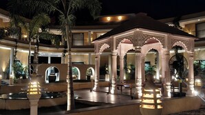 A courtyard with a central fountain, ornate lamp posts, and a gazebo. - Vaikunth Village Resort (Abhanpur)