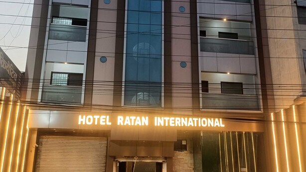 A modern building with a sign reading "HOTEL RATAN INTERNATIONAL". - Townhouse GE Road Raipur Formerly Ratan (Raipur)