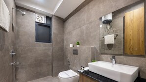 A modern bathroom with a large sink, a toilet, and a shower area. - Kasauli Heights (Kasauli)