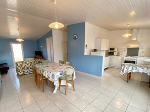 A compact kitchen with white cabinets, a microwave, and a stove. - Quiet House, 3 Bedrooms, Sleeps 6 - Pets Welcome! (Bretignolles-sur-Mer)