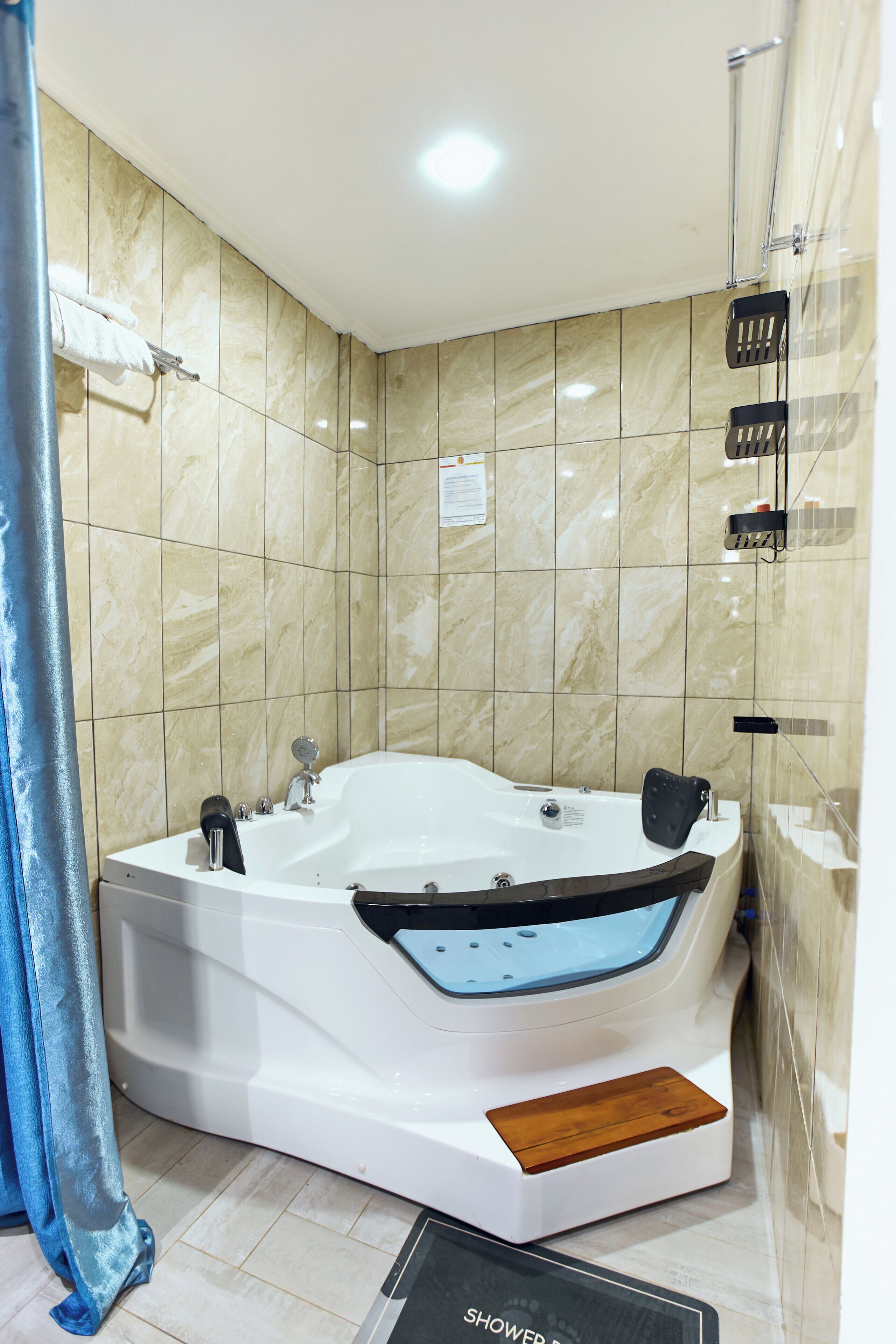 Luxury Suite, Balcony, City View | Bathroom | Shower, towels, soap, shampoo