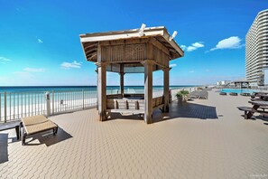 A wooden gazebo with a view of the ocean and a beachside walkway. - NEW Treasure Island 911-Heated Pool, Hot Tub, Grills, FREE Beach Service&Golf (Panama City Beach)