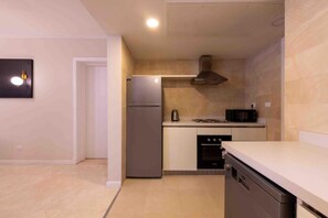 Apartment, Balcony, Garden View | Private kitchen - PyramidsHills Near Grand Egyptian Museum (Giza)