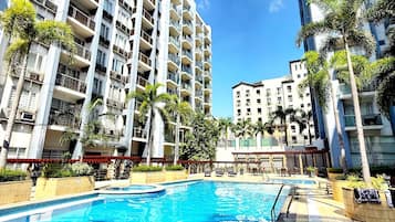 Outdoor pool, open 8:00 AM to 10:00 PM, pool umbrellas, pool loungers