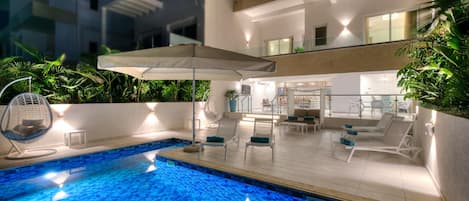 Outdoor pool, pool umbrellas, pool loungers