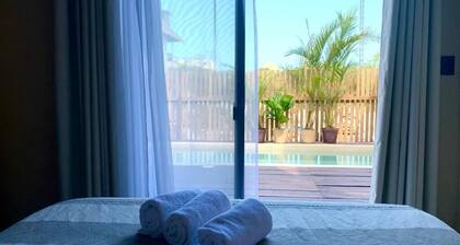 Eco‑Chic Wood 3BR Casa with Pool & Rooftop views