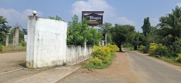 A sign for Bhagya Resort with a DELUXE ROOM.