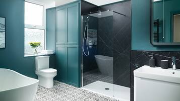 Shower, hair dryer, towels, toilet paper