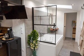 Jetted bath, hair dryer, towels, soap