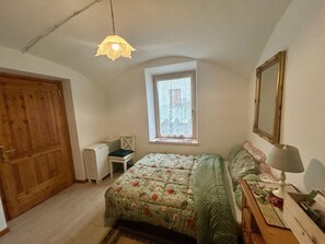 1 bedroom, desk, iron/ironing board, travel crib