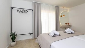 A modern hotel room with a bed, a bedside table with a mirror, a potted plant, and a large window with curtains. - Dare Apartment with private pool and garden (Kaštel Sućurac)