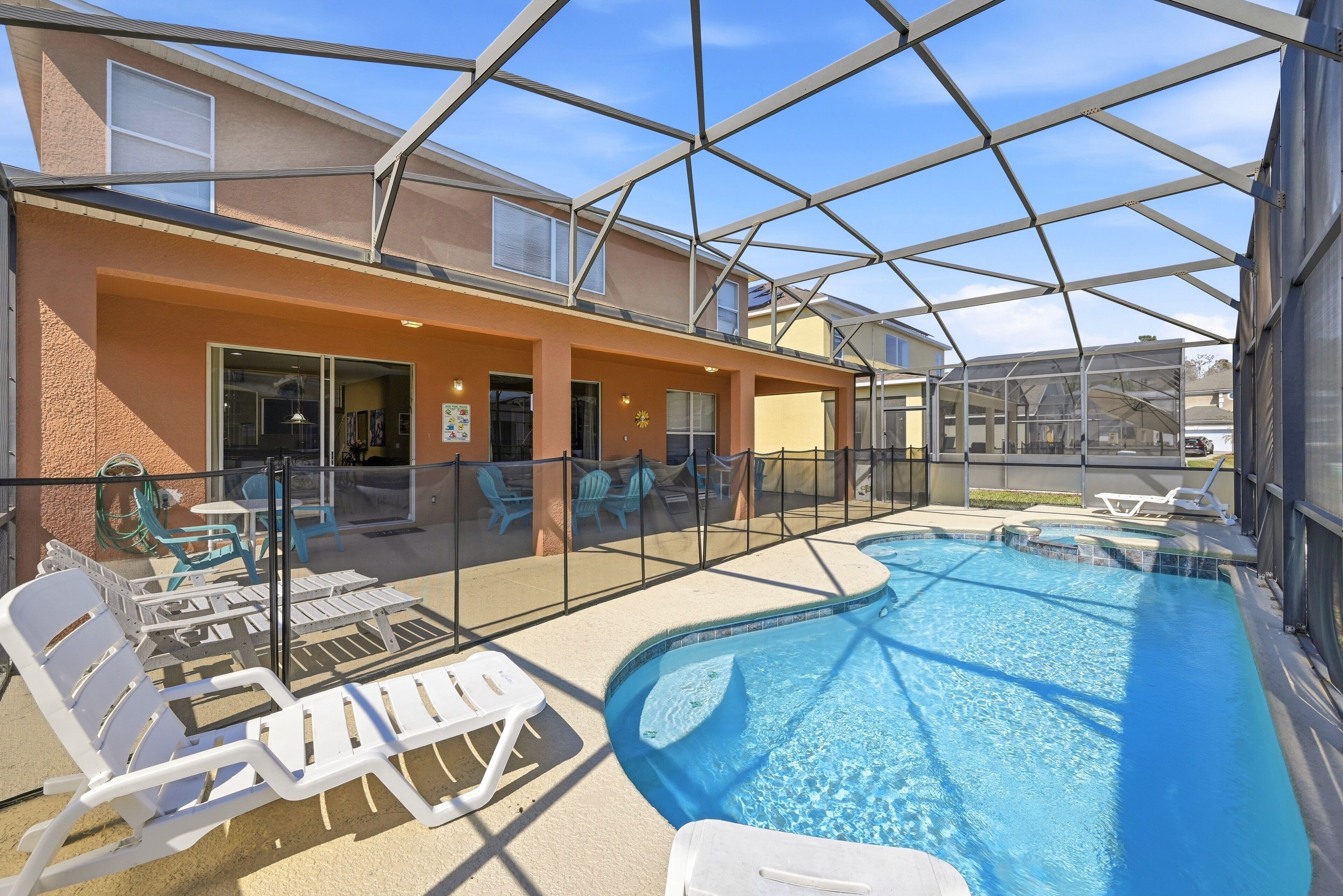 Take a refreshing dip in your private pool, complete with outdoor seating.