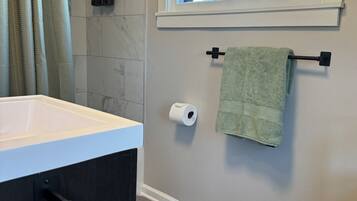 Hair dryer, towels, soap, toilet paper