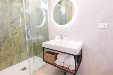 Shower, hair dryer, bidet, towels. ARQO Comfort Apartment – One Bedroom with Living Room