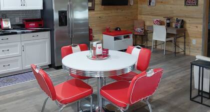 Relaxing 2-bedroom cabin decorated with Coke Cola Theme,
