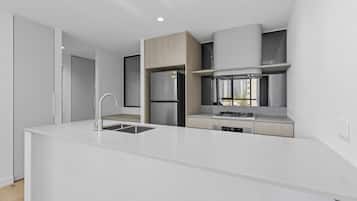 Two Bedroom One Bathroom Apartment | Private kitchen | Full-size fridge, microwave, oven, stovetop
