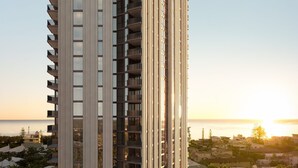 A high-rise building with multiple balconies, a pool, and a view of the sea. - Yves Mermaid Beach Apartments by CLLIX (Mermaid Beach)