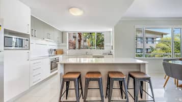 Deluxe Apartment, Balcony, Sea View | Private kitchen | Toaster, freezer, dining table