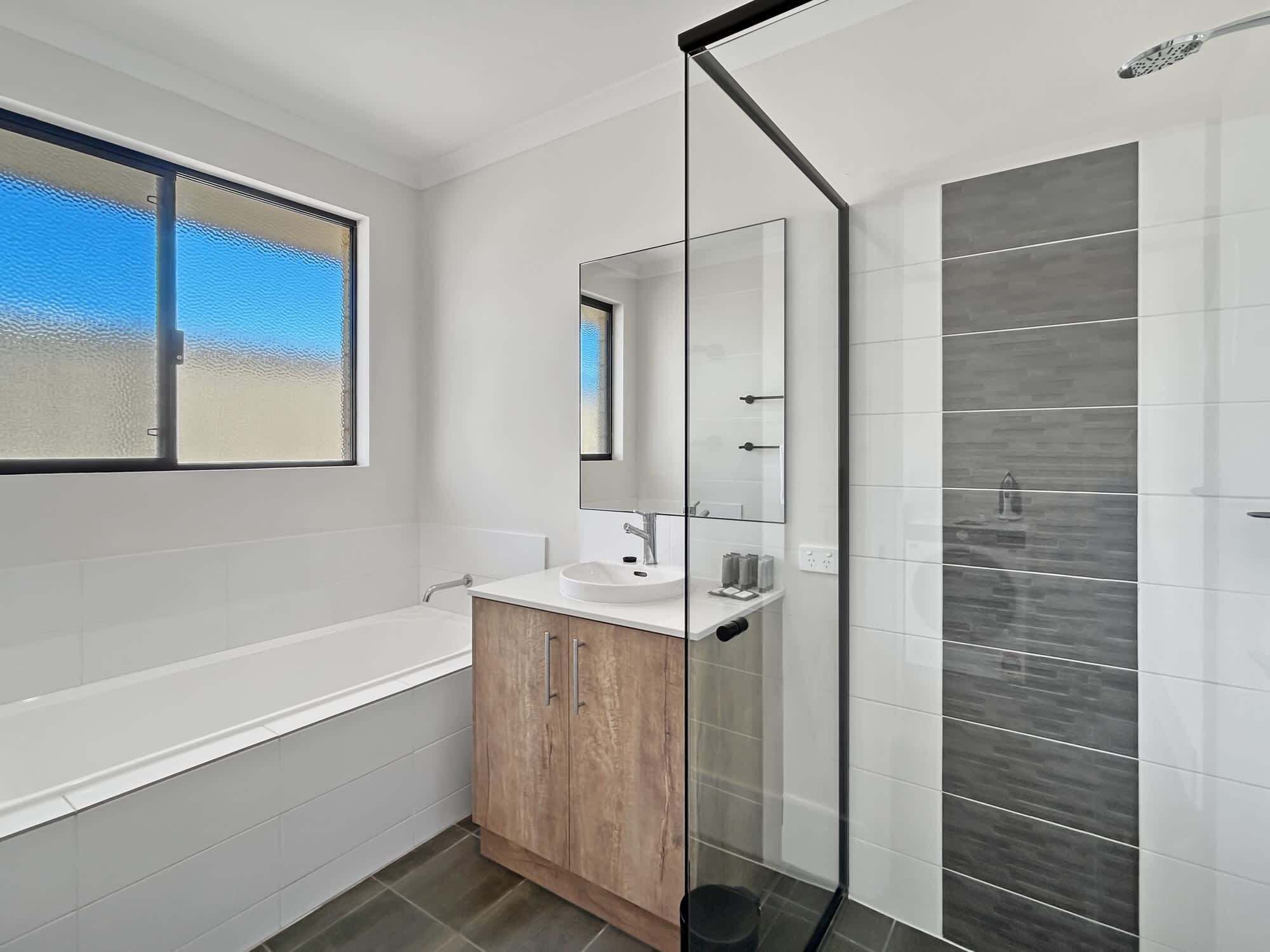 Shower, hair dryer, towels, shampoo