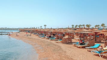 Private beach, free beach shuttle, sun-loungers, beach umbrellas